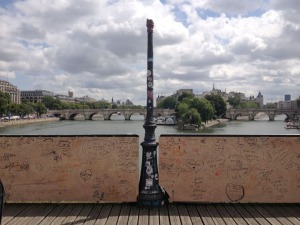 What's left of the Pont des Arts. A lamp missing, brought down by the weight of locks.